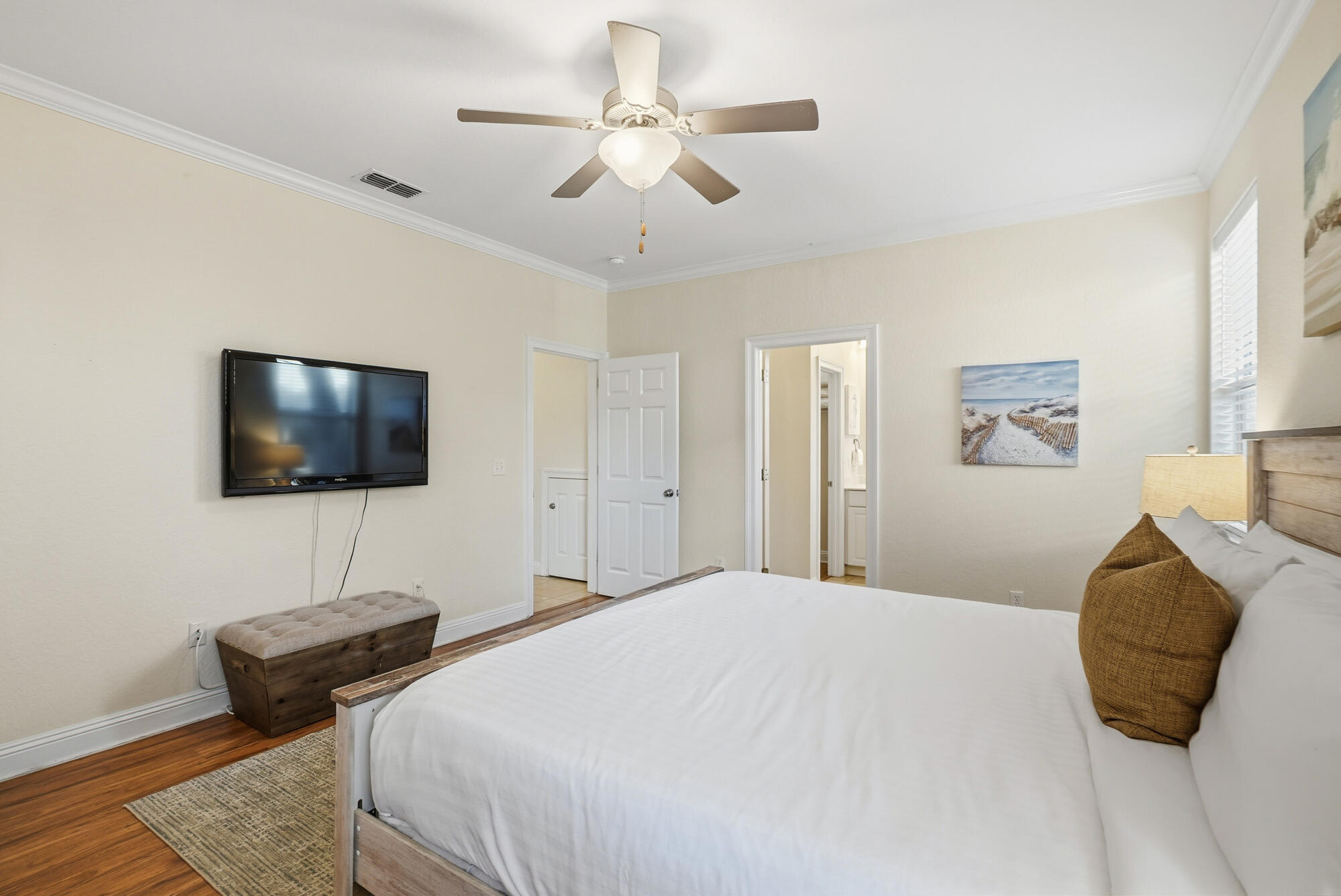 231 Kono Way Destin, FL 32541 - Photo 15 of 41 a bedroom with a bed a flat screen tv and a couch