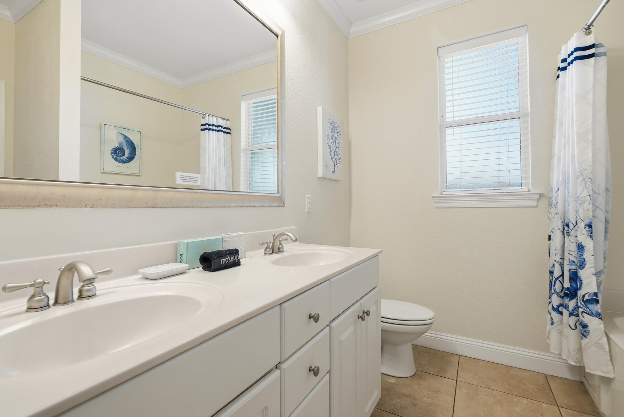 231 Kono Way Destin, FL 32541 - Photo 16 of 41 a bathroom with a sink a toilet and shower