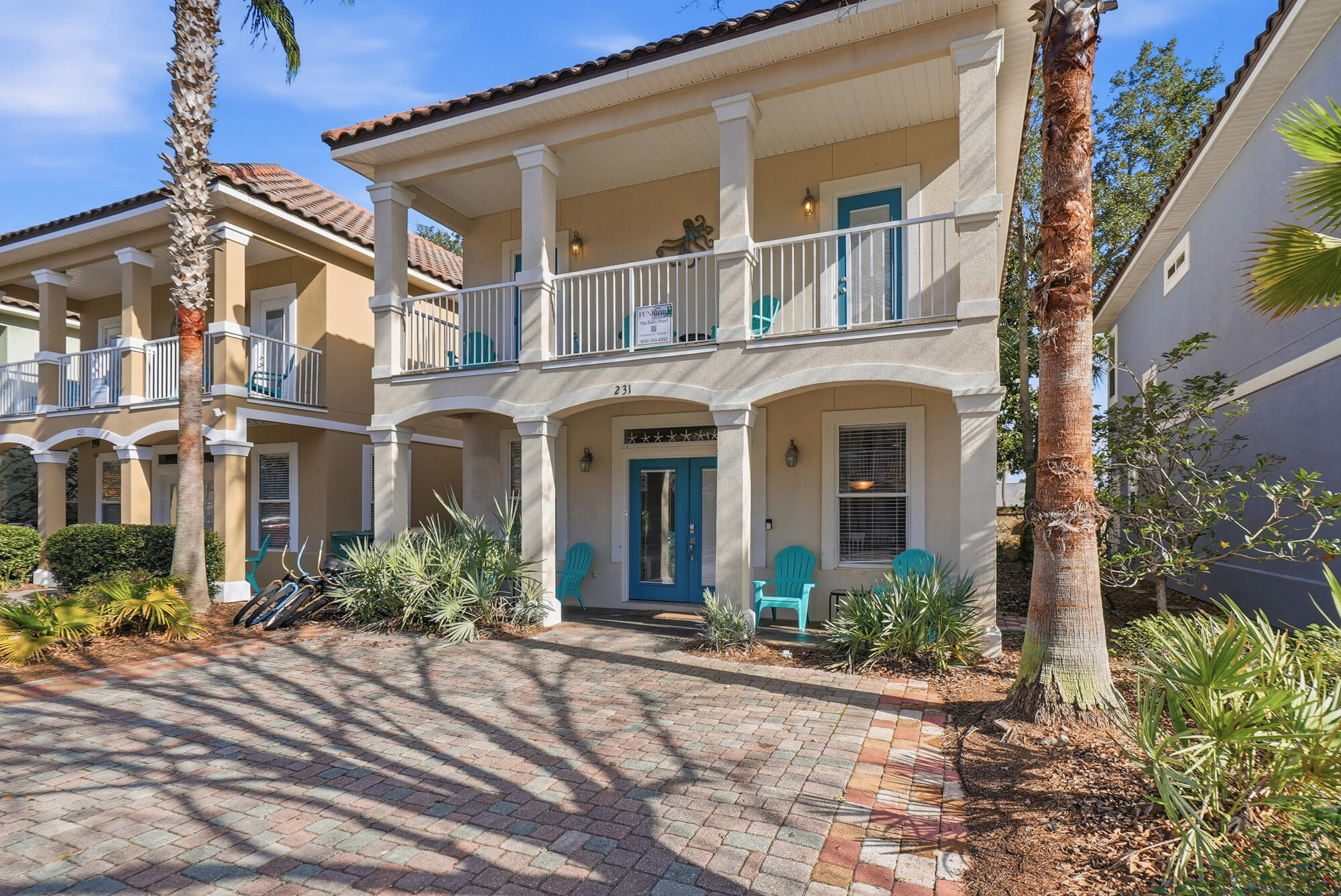 231 Kono Way Destin, FL 32541 - Photo 2 of 41 front view of a brick house with a small yard
