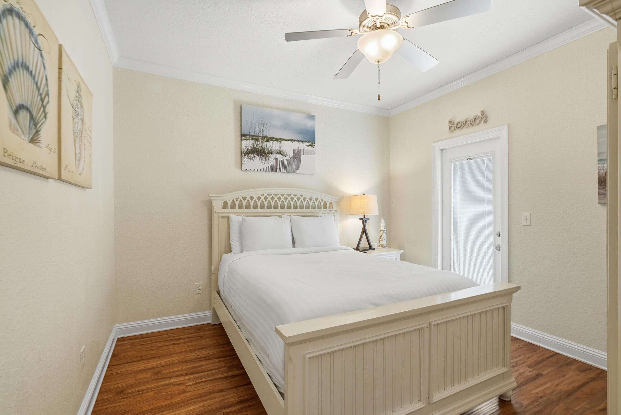 231 Kono Way Destin, FL 32541 - Photo 21 of 41 a bedroom with a bed and a chandelier
