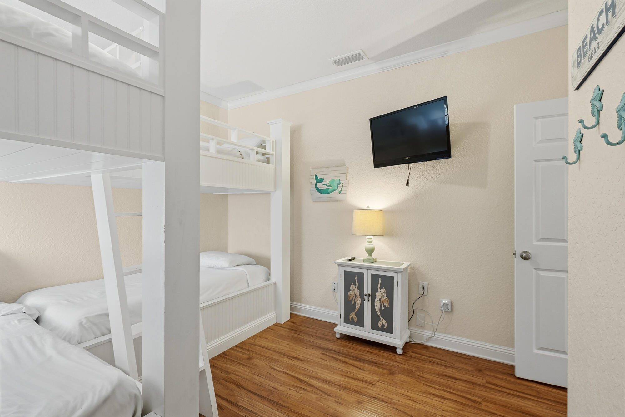 231 Kono Way Destin, FL 32541 - Photo 25 of 41 a living room with a flat screen tv and a couch