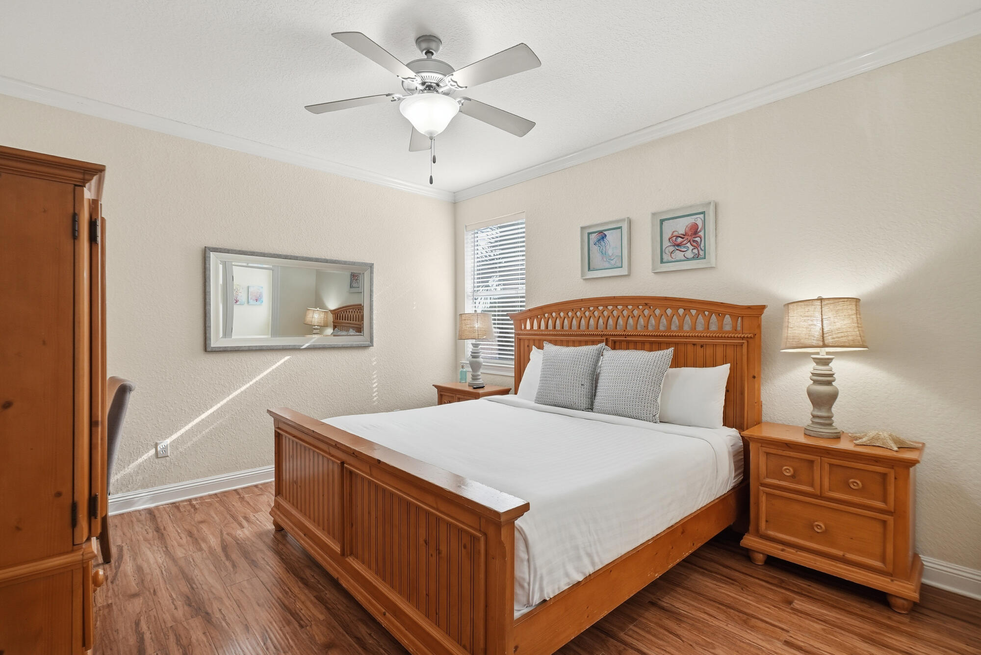231 Kono Way Destin, FL 32541 - Photo 26 of 41 a large bedroom with a bed and wooden floor