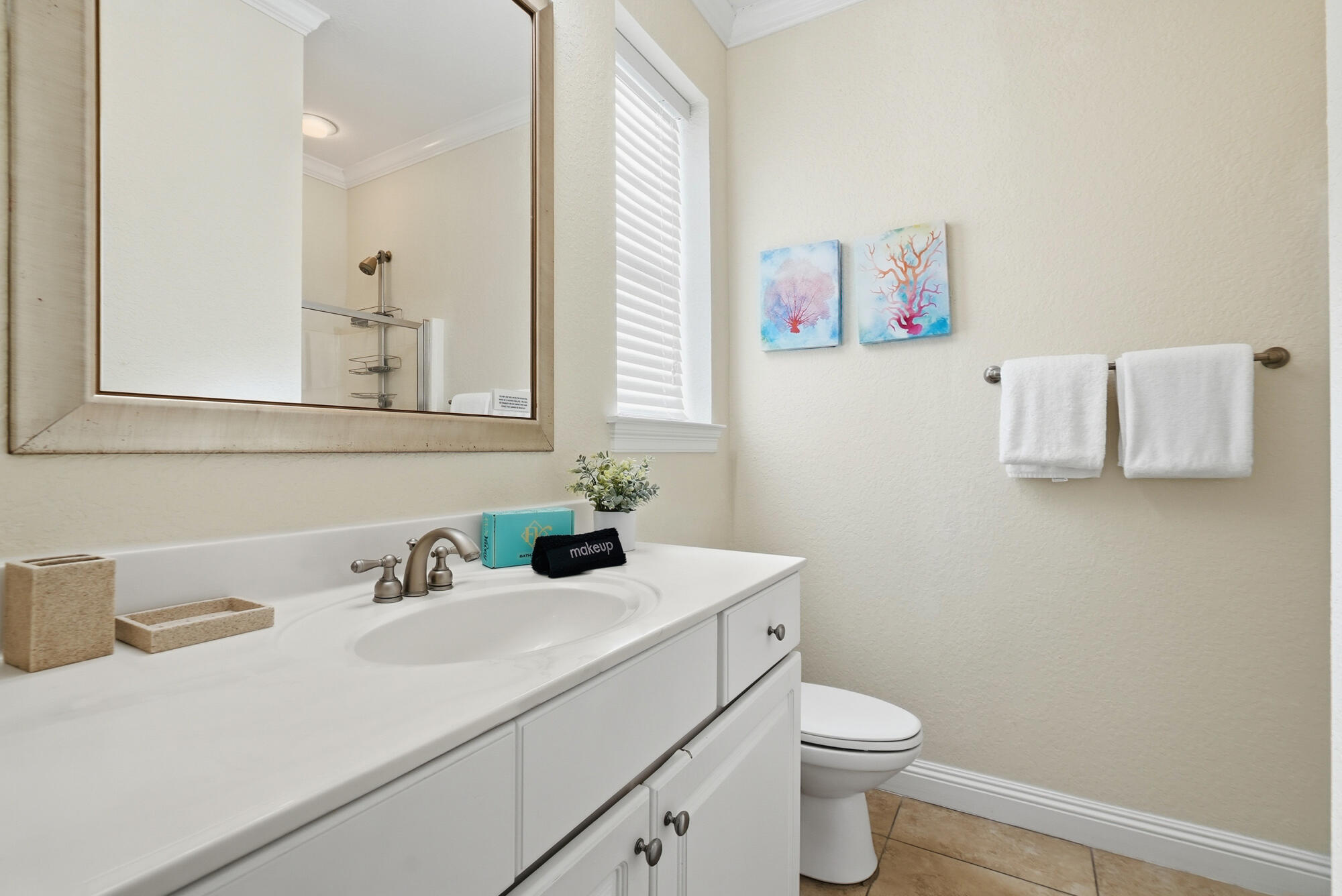 231 Kono Way Destin, FL 32541 - Photo 28 of 41 a bathroom with a sink vanity mirror and toilet