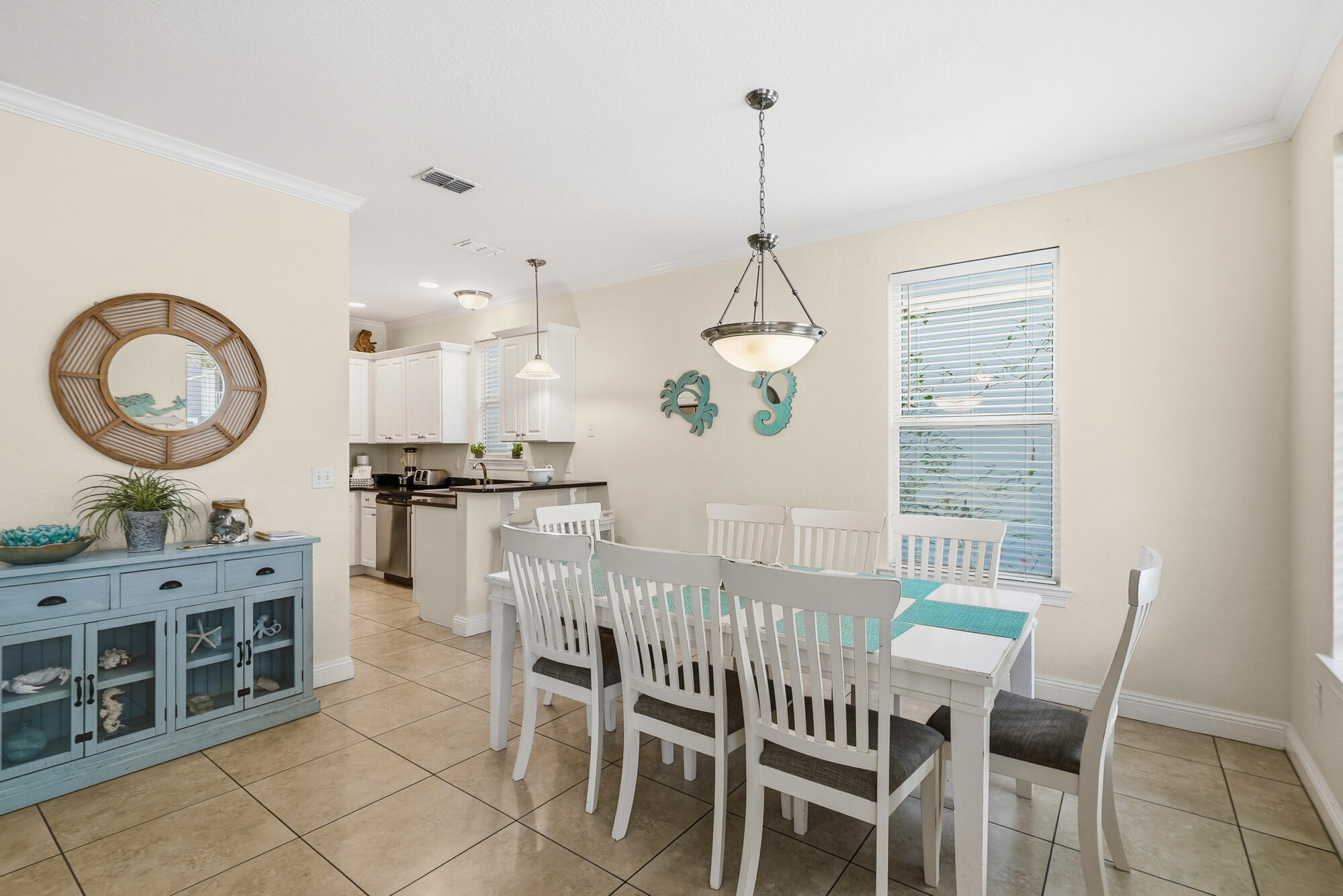 231 Kono Way Destin, FL 32541 - Photo 8 of 41 a view of a dining room with furniture window and wooden floor