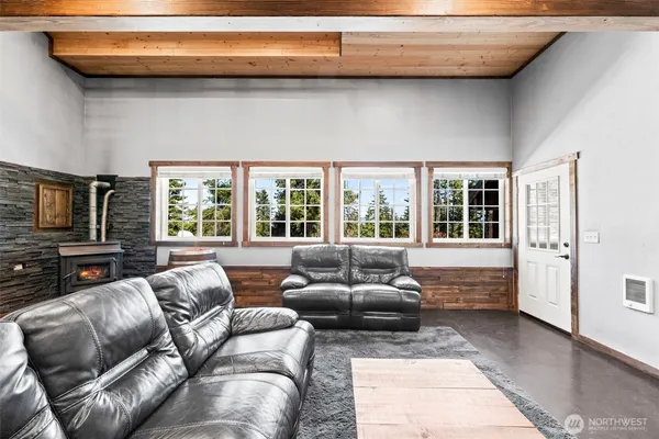 a bedroom with furniture and a fireplace