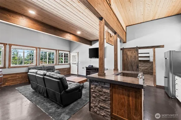 a kitchen with stainless steel appliances granite countertop a stove and a refrigerator