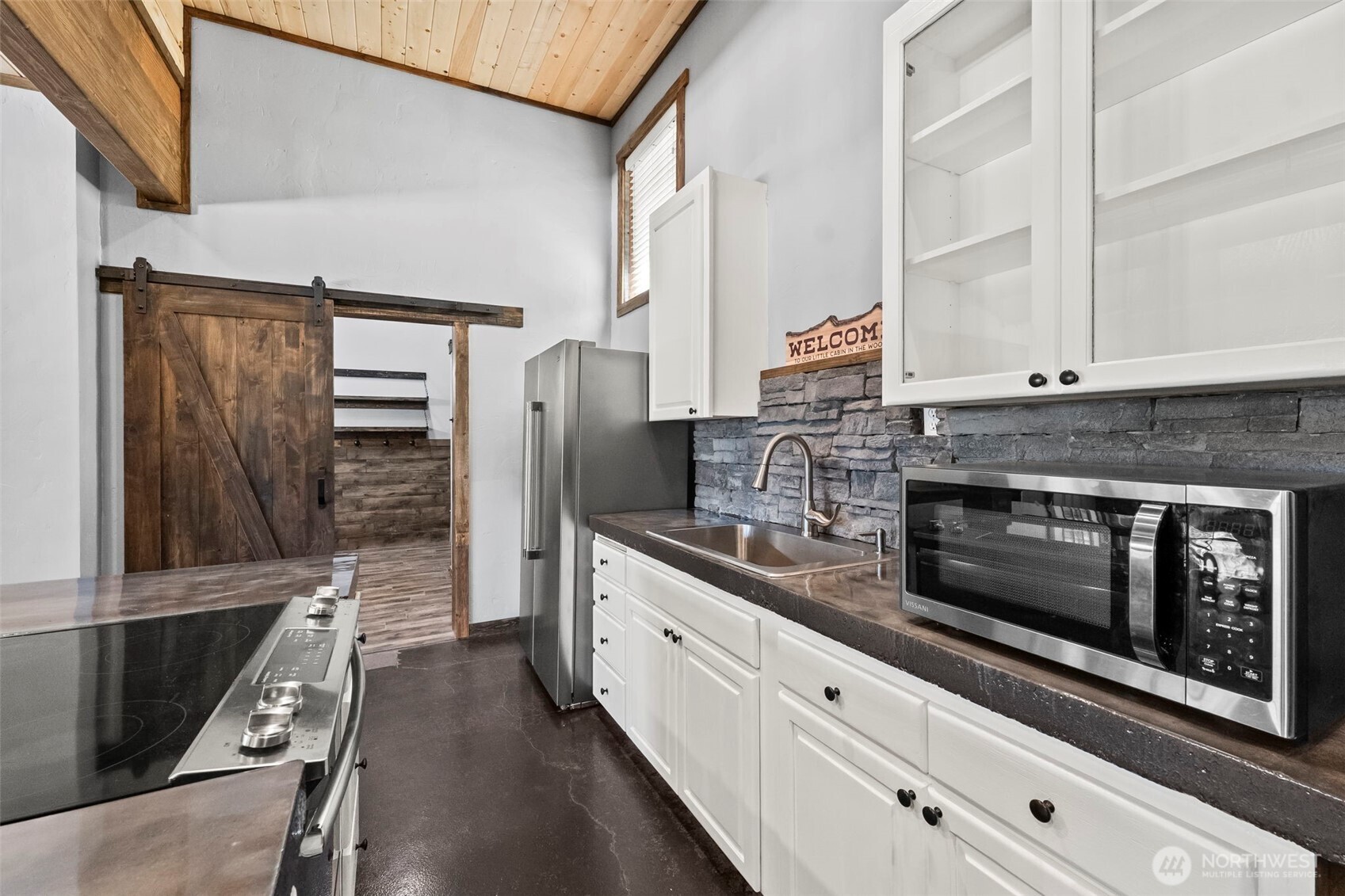 130 Horse Heaven Road Cle Elum, WA 98922 - Photo 22 of 34 a kitchen with stainless steel appliances white cabinets and a refrigerator