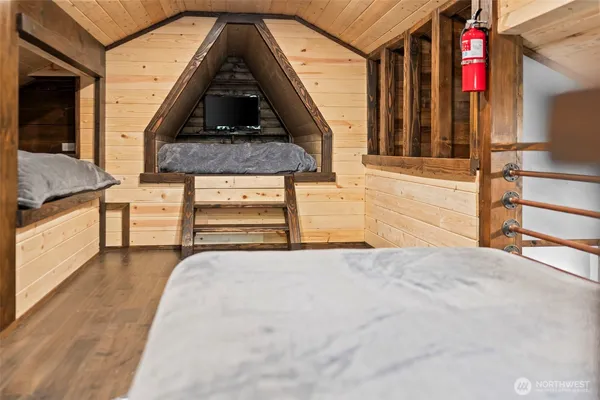 a bedroom with furniture and a ceiling fan