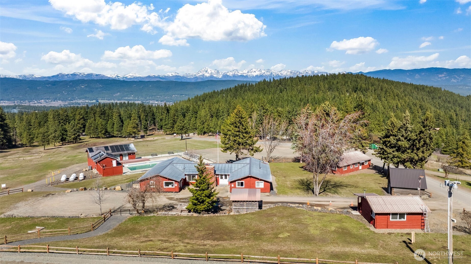130 Horse Heaven Road Cle Elum, WA 98922 - Photo 3 of 34 a view of swimming pool with a yard and mountain view in back