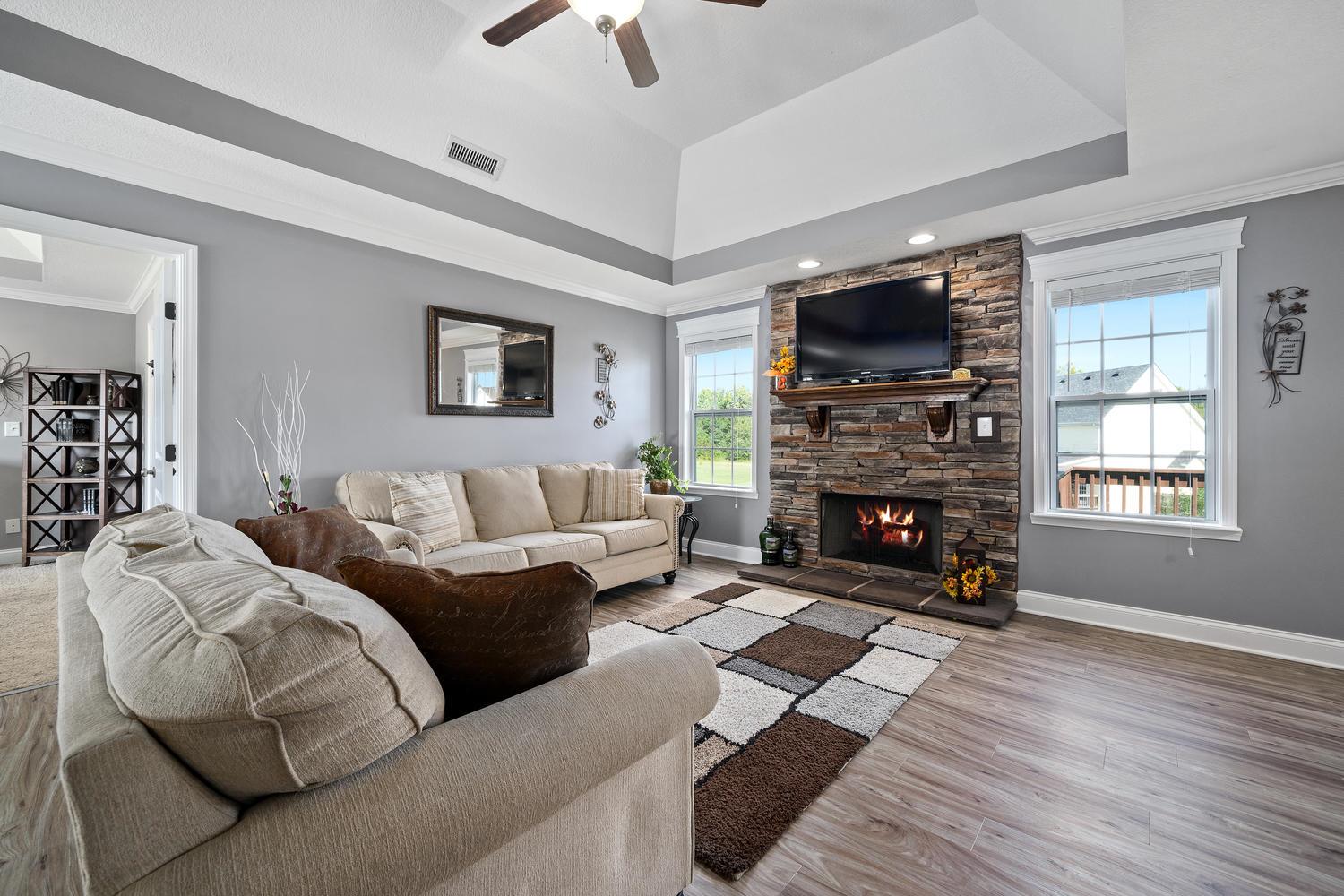 3803 Suiter Road Clarksville, TN 37040 - Photo 16 of 28 a living room with furniture a flat screen tv and a fireplace