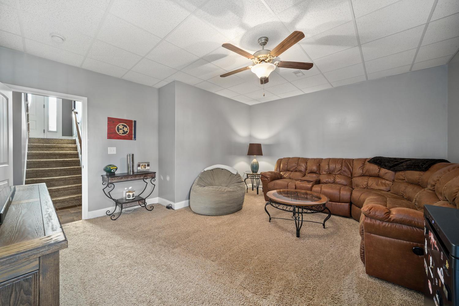 3803 Suiter Road Clarksville, TN 37040 - Photo 20 of 28 a living room with furniture and a chandelier