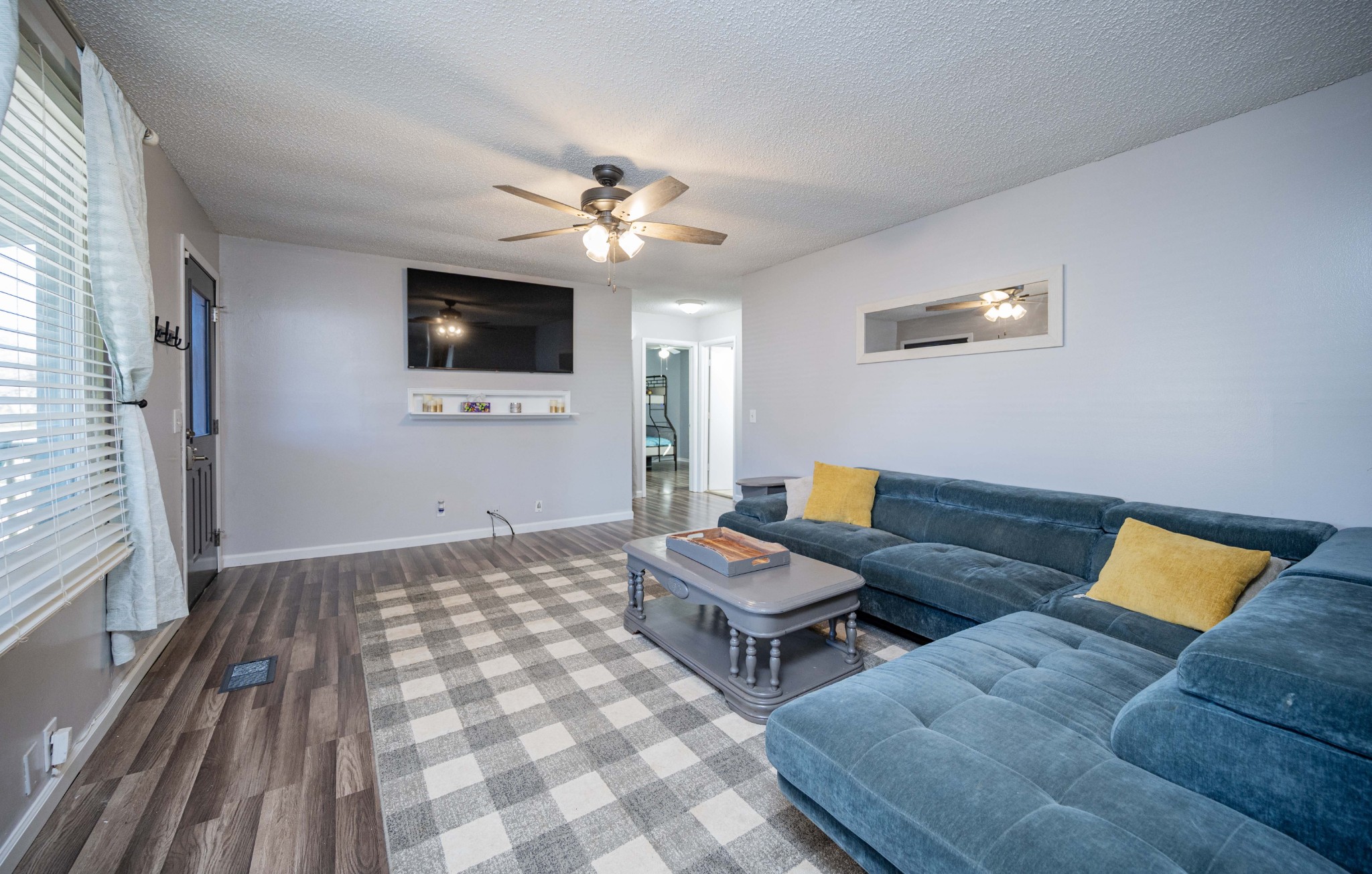 6620 Amanda Way Murfreesboro, TN 37129 - Photo 5 of 23 a living room with furniture and a flat screen tv
