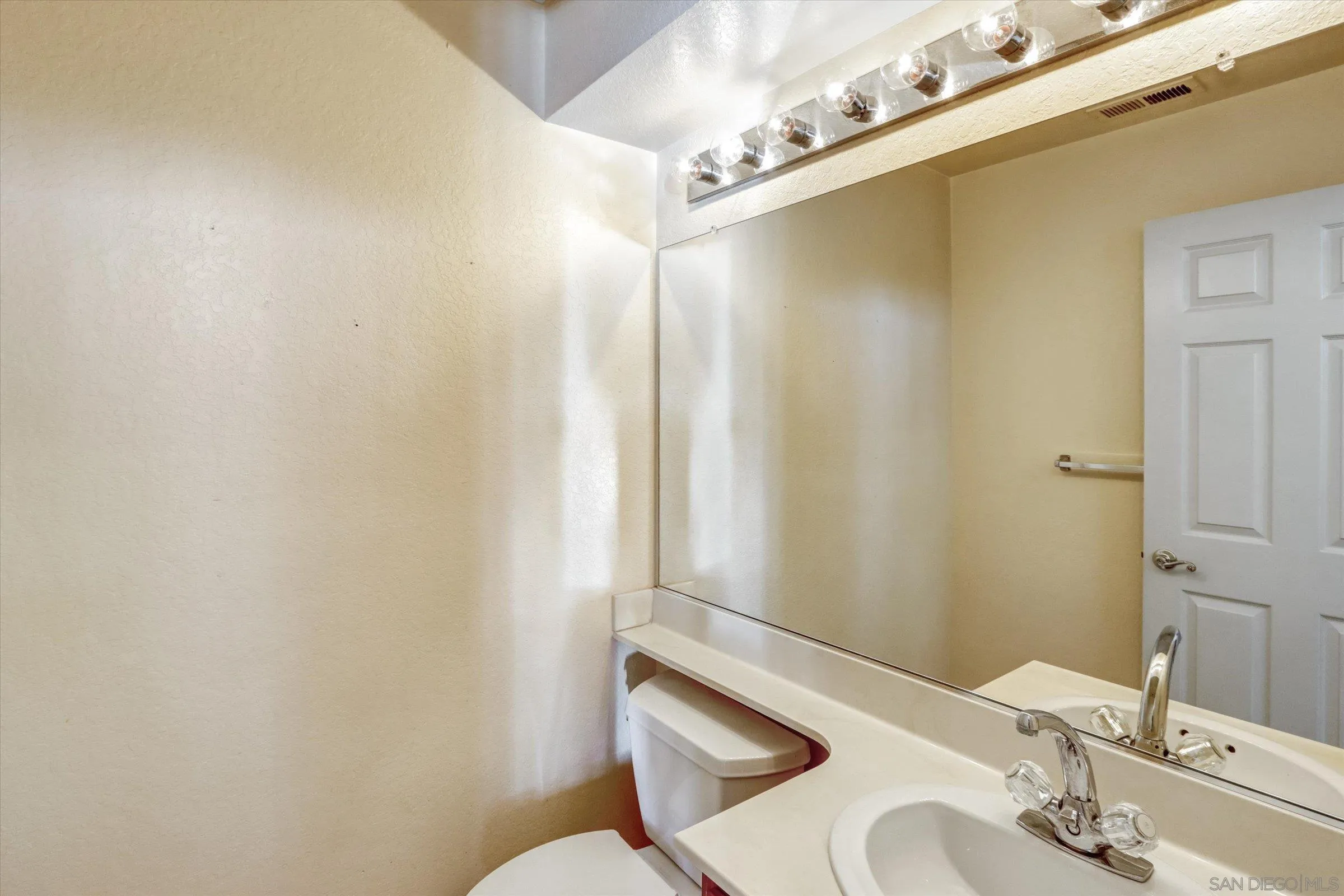 1840 Cabernet Drive Chula Vista, CA 91913 - Photo 19 of 66 a bathroom with a sink and a mirror