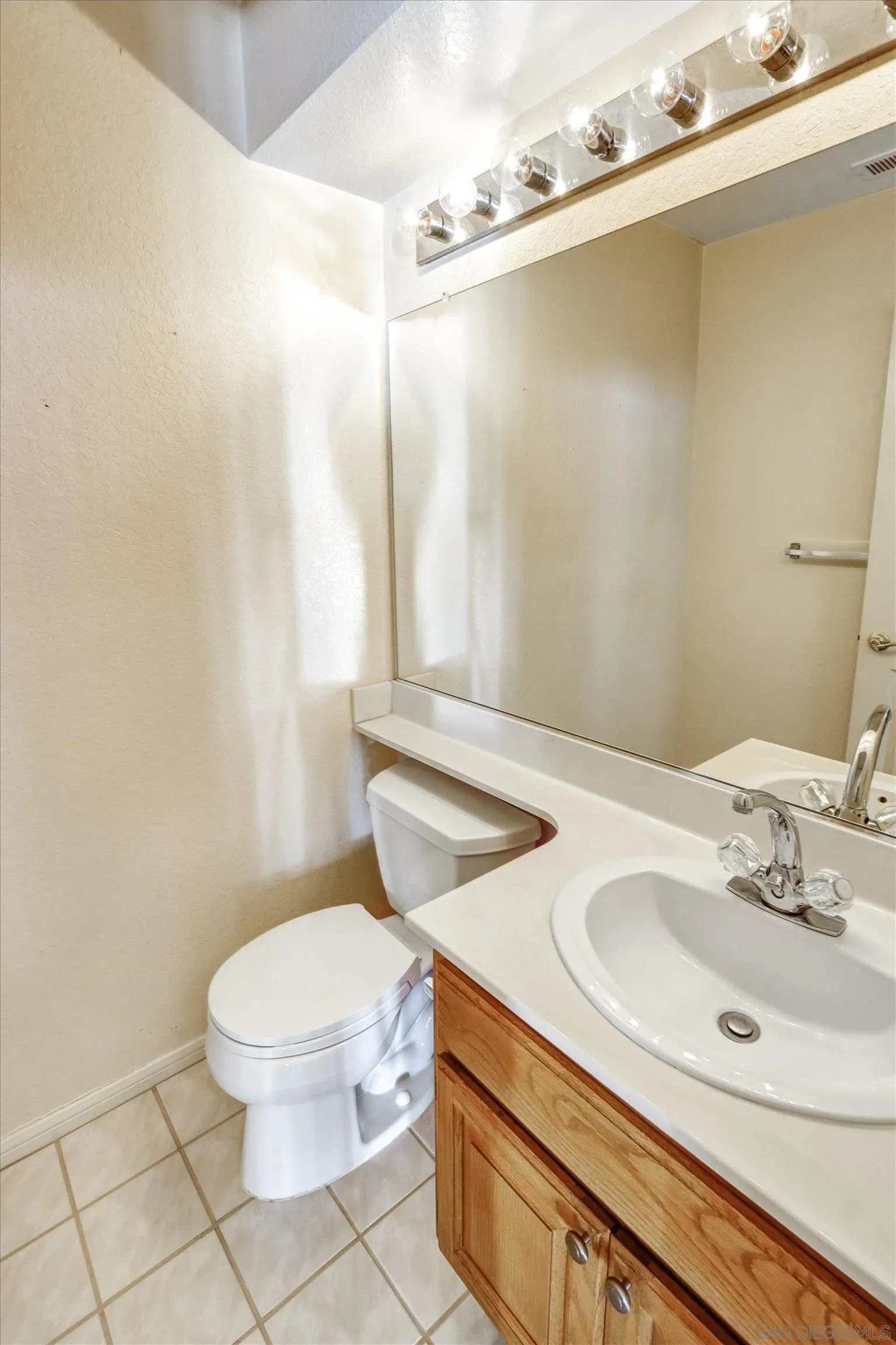 1840 Cabernet Drive Chula Vista, CA 91913 - Photo 20 of 66 a bathroom with a sink a toilet and a mirror