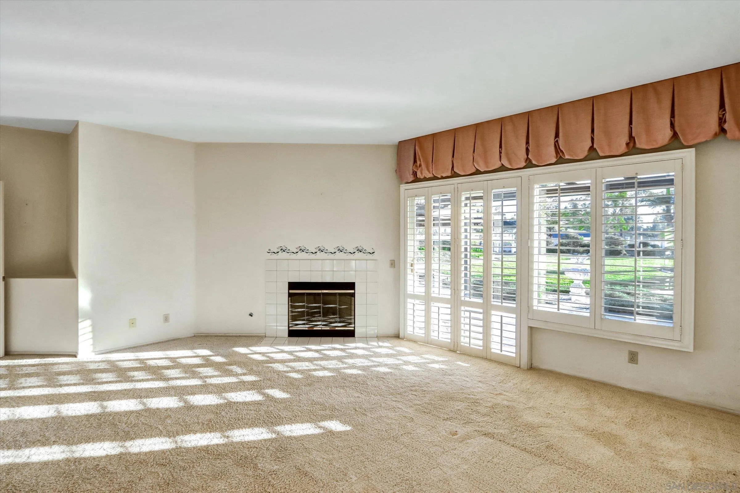 1840 Cabernet Drive Chula Vista, CA 91913 - Photo 23 of 66 a view of an empty room with a fireplace and a window