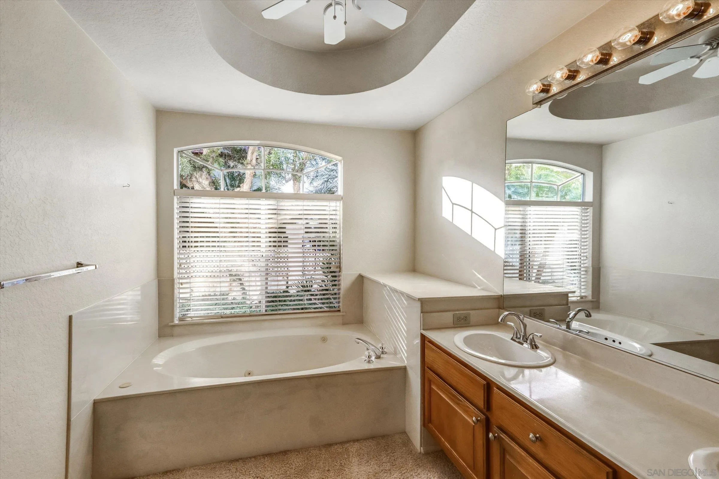 1840 Cabernet Drive Chula Vista, CA 91913 - Photo 25 of 66 a bathroom with a tub sink and mirror