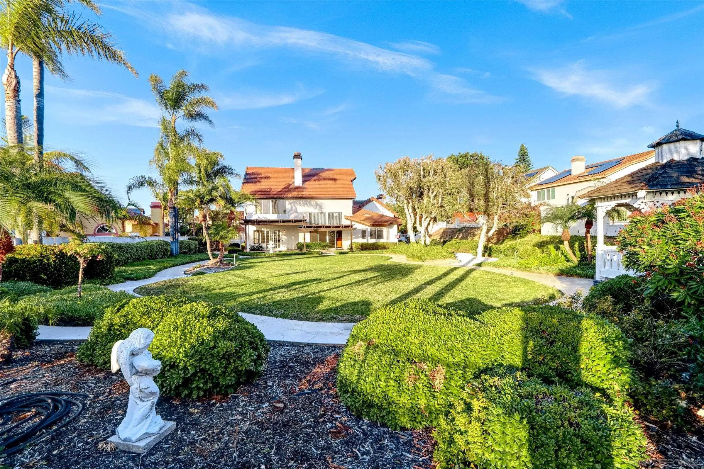 1840 Cabernet Drive Chula Vista, CA 91913 - Photo 49 of 66 a view of a yard with plants and palm trees