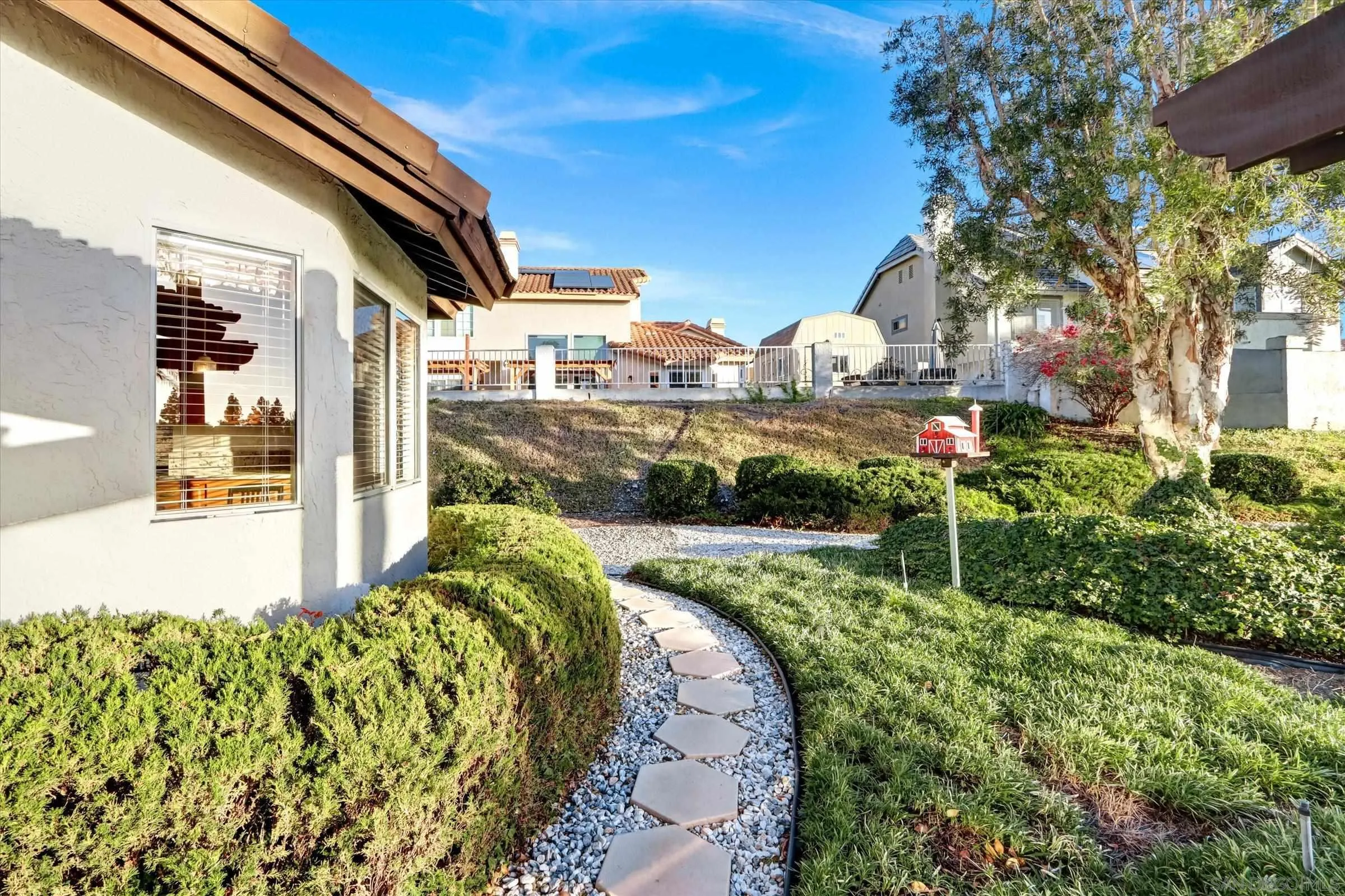 1840 Cabernet Drive Chula Vista, CA 91913 - Photo 54 of 66 a front view of a house with a yard fountain and a fountain