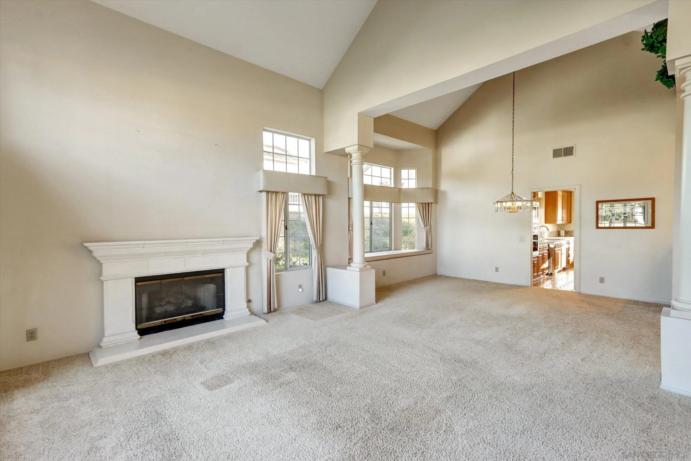 1840 Cabernet Drive Chula Vista, CA 91913 - Photo 7 of 66 an empty room with windows and fireplace
