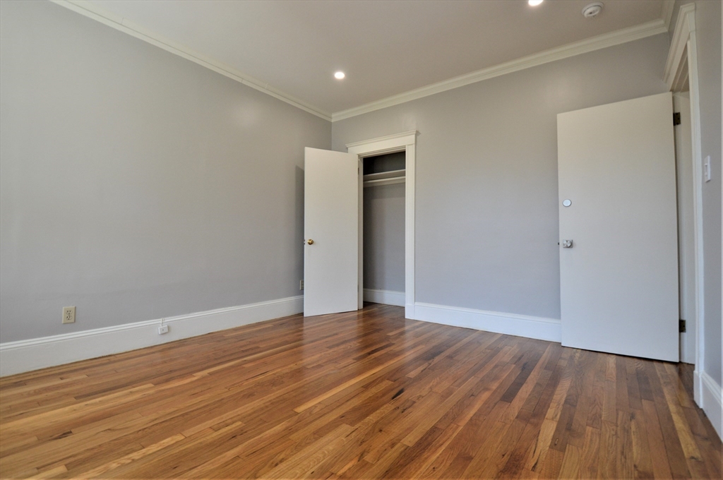 27 Ransom Road, Unit 2 Boston, MA 02135 - Photo 14 of 29 a view of an empty room with wooden floor