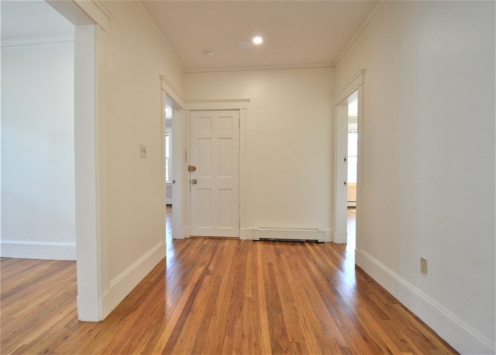 27 Ransom Road, Unit 2 Boston, MA 02135 - Photo 22 of 29 a view of a room with wooden floor