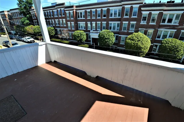 a view of balcony and yard