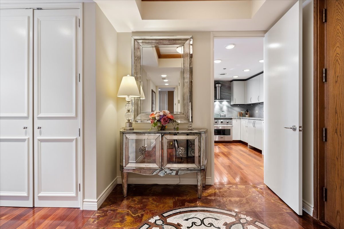 180 East Pearson Street, Unit 4002 Chicago, IL 60611 - Photo 6 of 33 a living room with furniture and a chandelier
