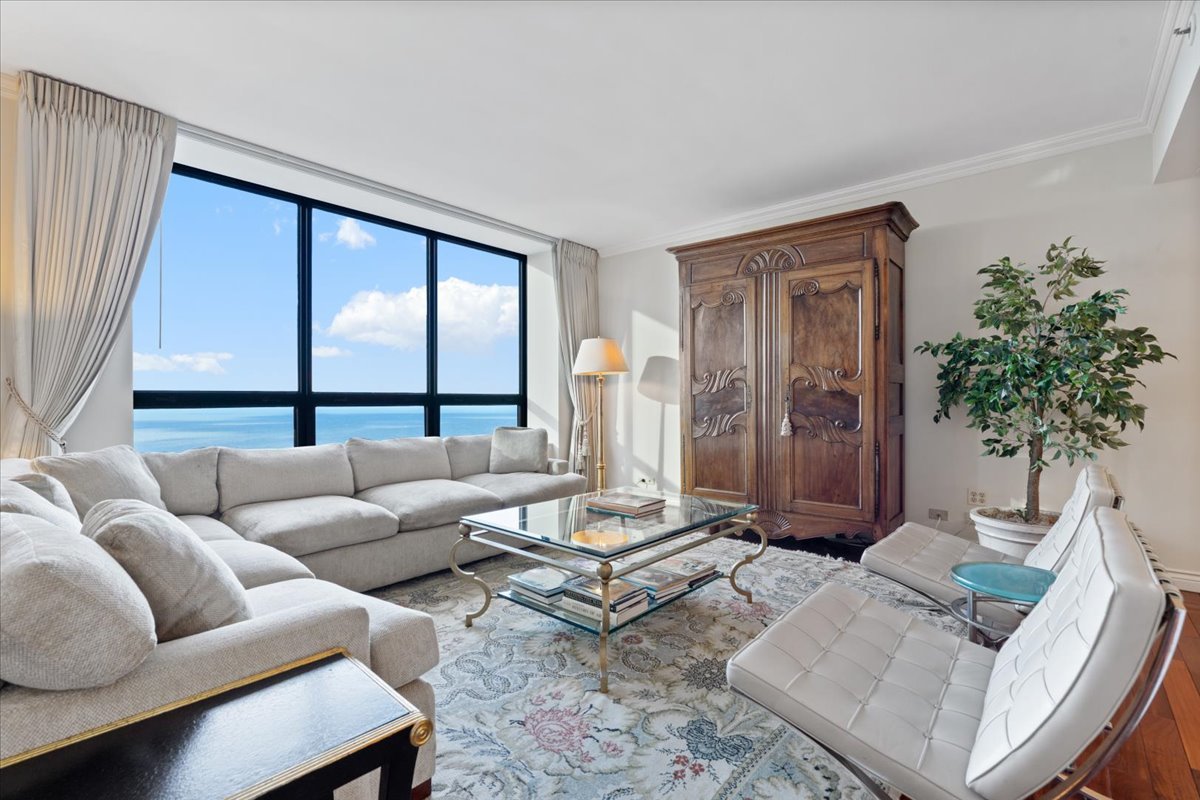 180 East Pearson Street, Unit 4002 Chicago, IL 60611 - Photo 8 of 33 a living room with furniture and a large window