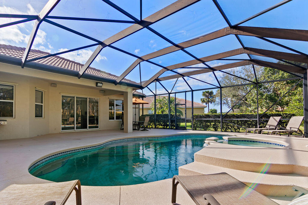 a swimming pool with outdoor seating yard and patio