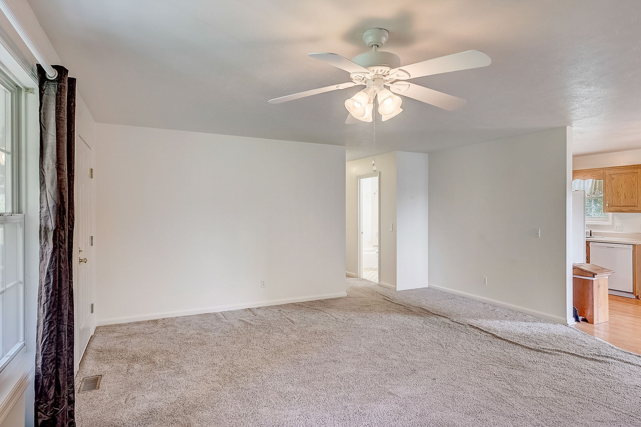 356 Howard Redmon Road Sparta, TN 38583 - Photo 13 of 68 an empty room with windows and fan