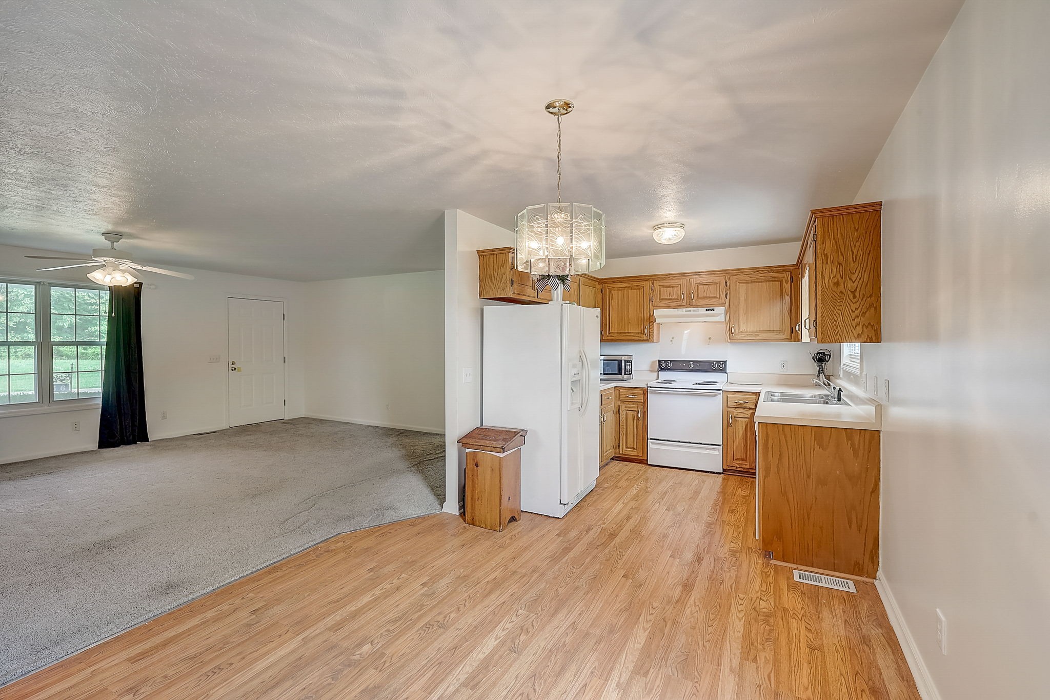 356 Howard Redmon Road Sparta, TN 38583 - Photo 16 of 68 a open kitchen with a refrigerator stove top oven and sink