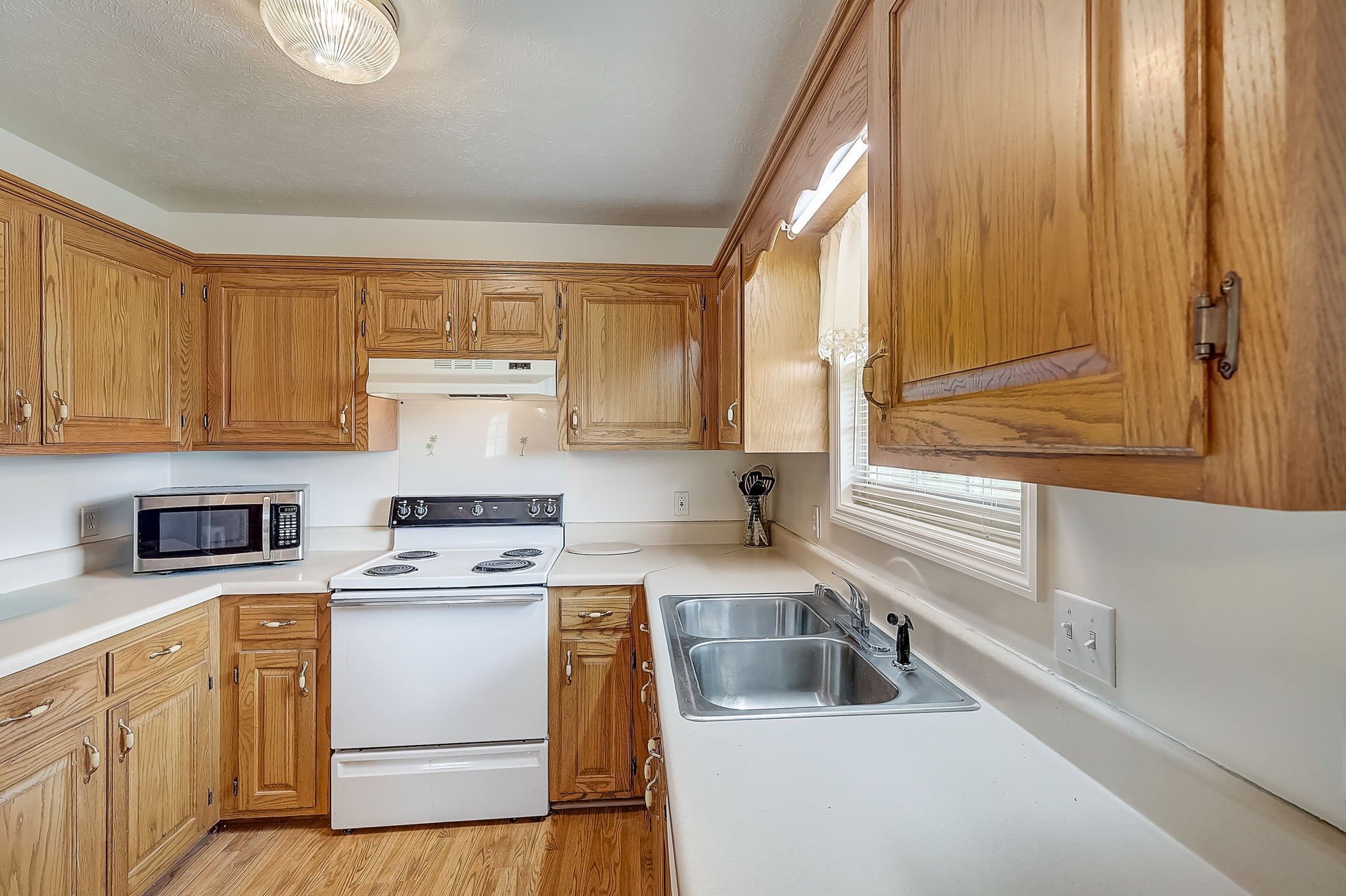 356 Howard Redmon Road Sparta, TN 38583 - Photo 17 of 68 a kitchen with cabinets appliances a sink and a window