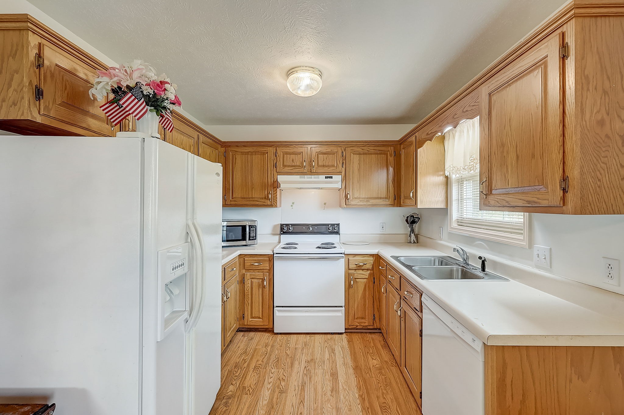 356 Howard Redmon Road Sparta, TN 38583 - Photo 19 of 68 a kitchen with a sink a refrigerator and window