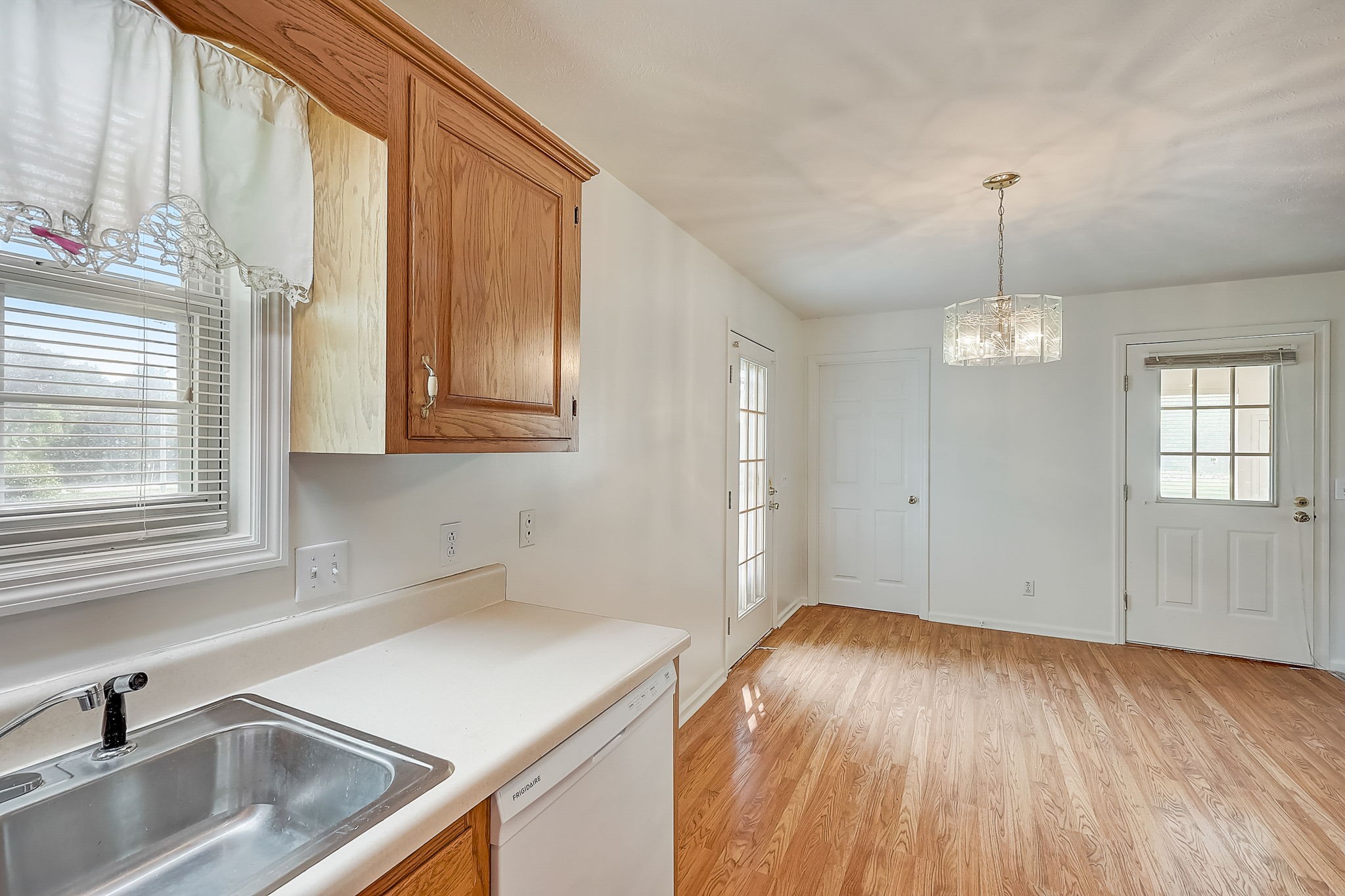 356 Howard Redmon Road Sparta, TN 38583 - Photo 20 of 68 a kitchen that has a sink stove and cabinets