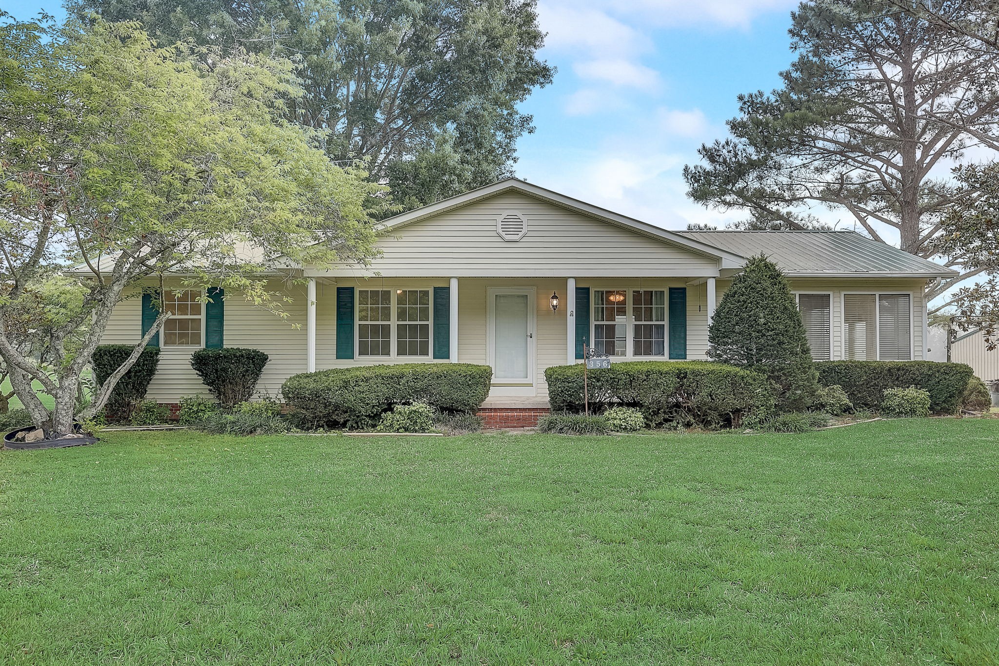 356 Howard Redmon Road Sparta, TN 38583 - Photo 2 of 68 a front view of a house with a yard and trees