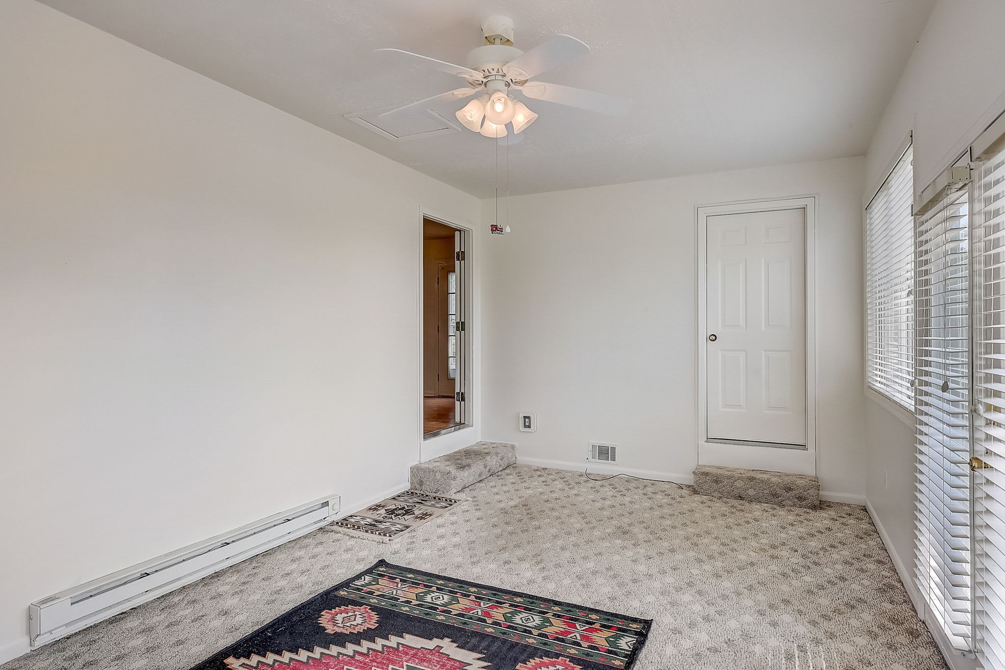 356 Howard Redmon Road Sparta, TN 38583 - Photo 23 of 68 a view of a livingroom with a chandelier fan and wooden floor