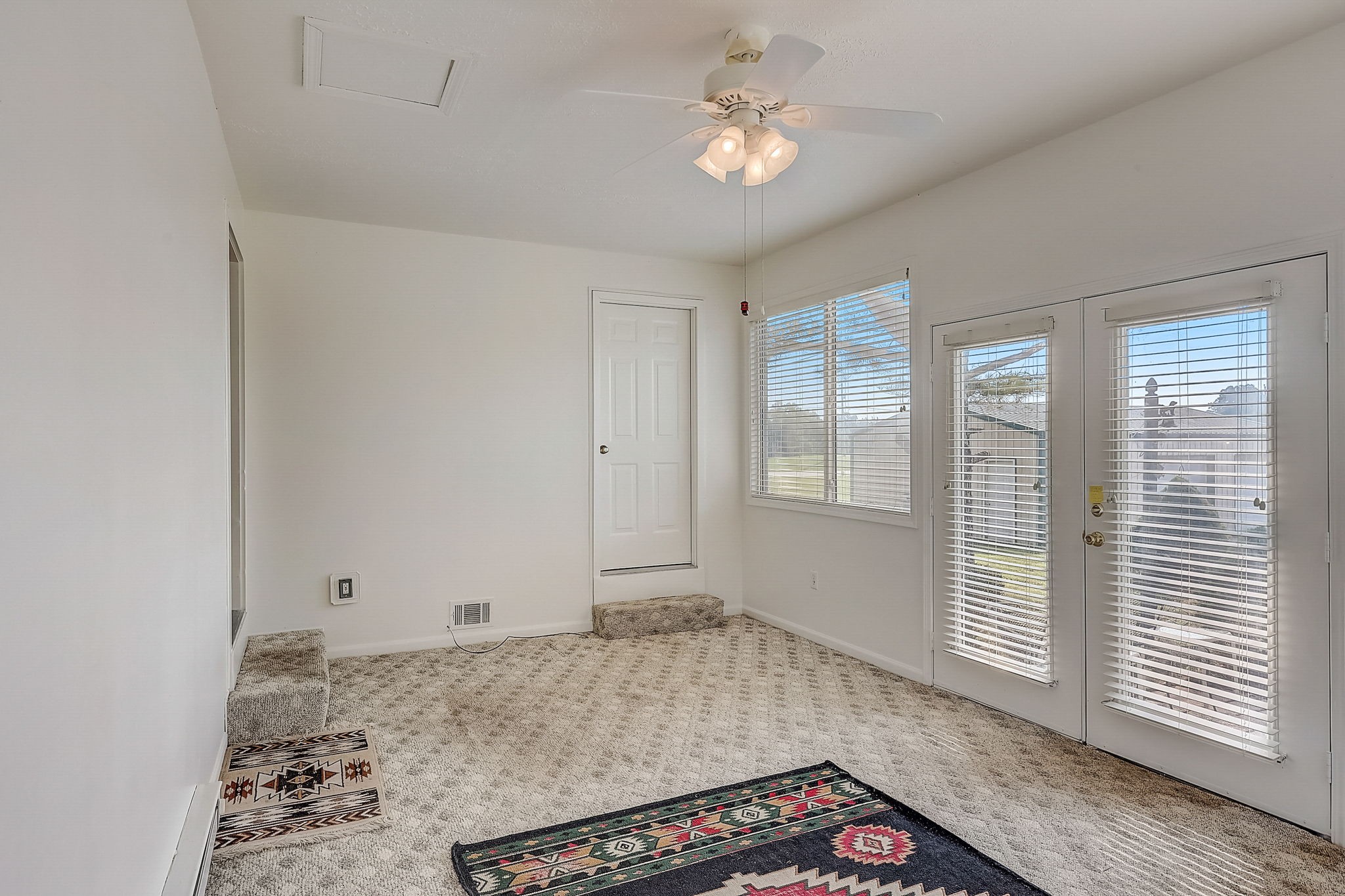 356 Howard Redmon Road Sparta, TN 38583 - Photo 24 of 68 a view of a livingroom with a chandelier fan and wooden floor