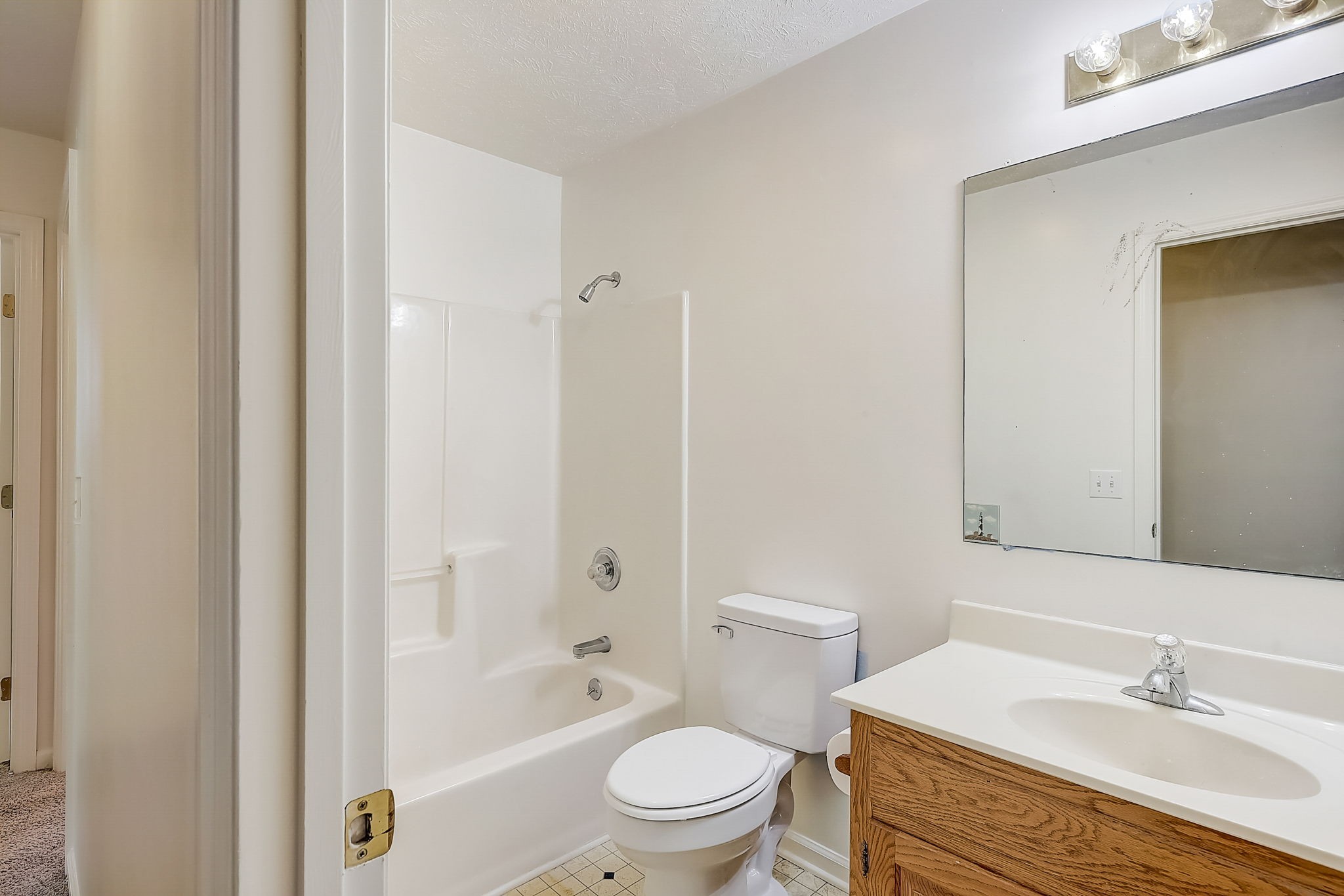 356 Howard Redmon Road Sparta, TN 38583 - Photo 27 of 68 a bathroom with a granite countertop sink a toilet and shower