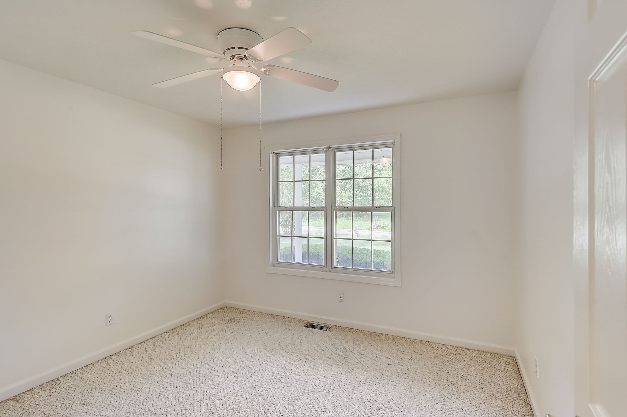 356 Howard Redmon Road Sparta, TN 38583 - Photo 28 of 68 an empty room with a window and a fan
