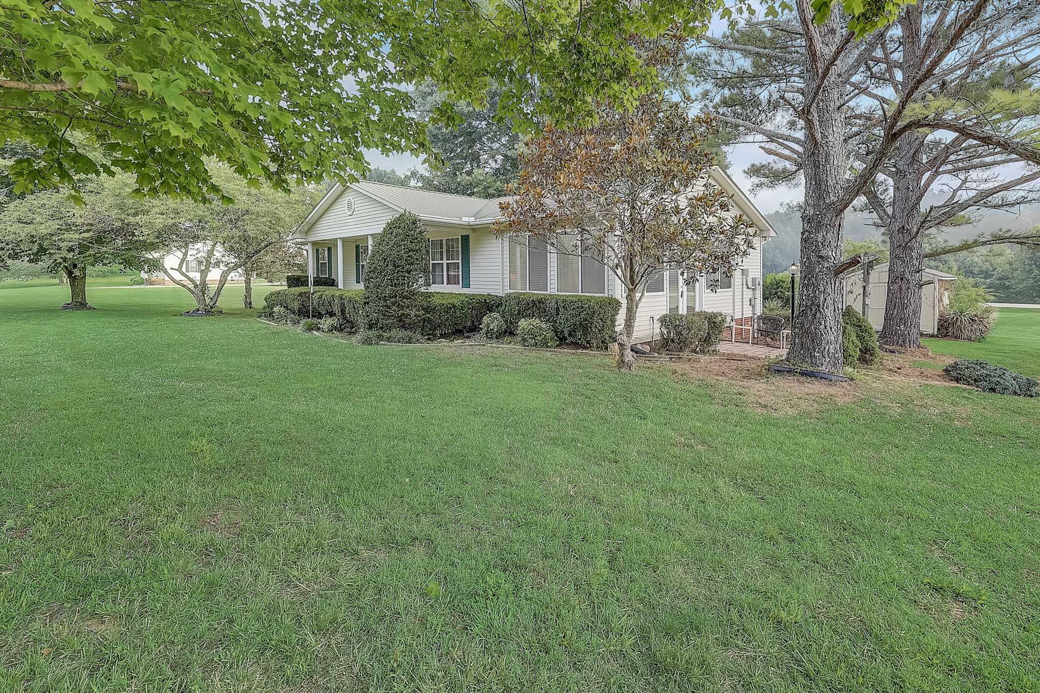 356 Howard Redmon Road Sparta, TN 38583 - Photo 44 of 68 a front view of a house with a yard and trees