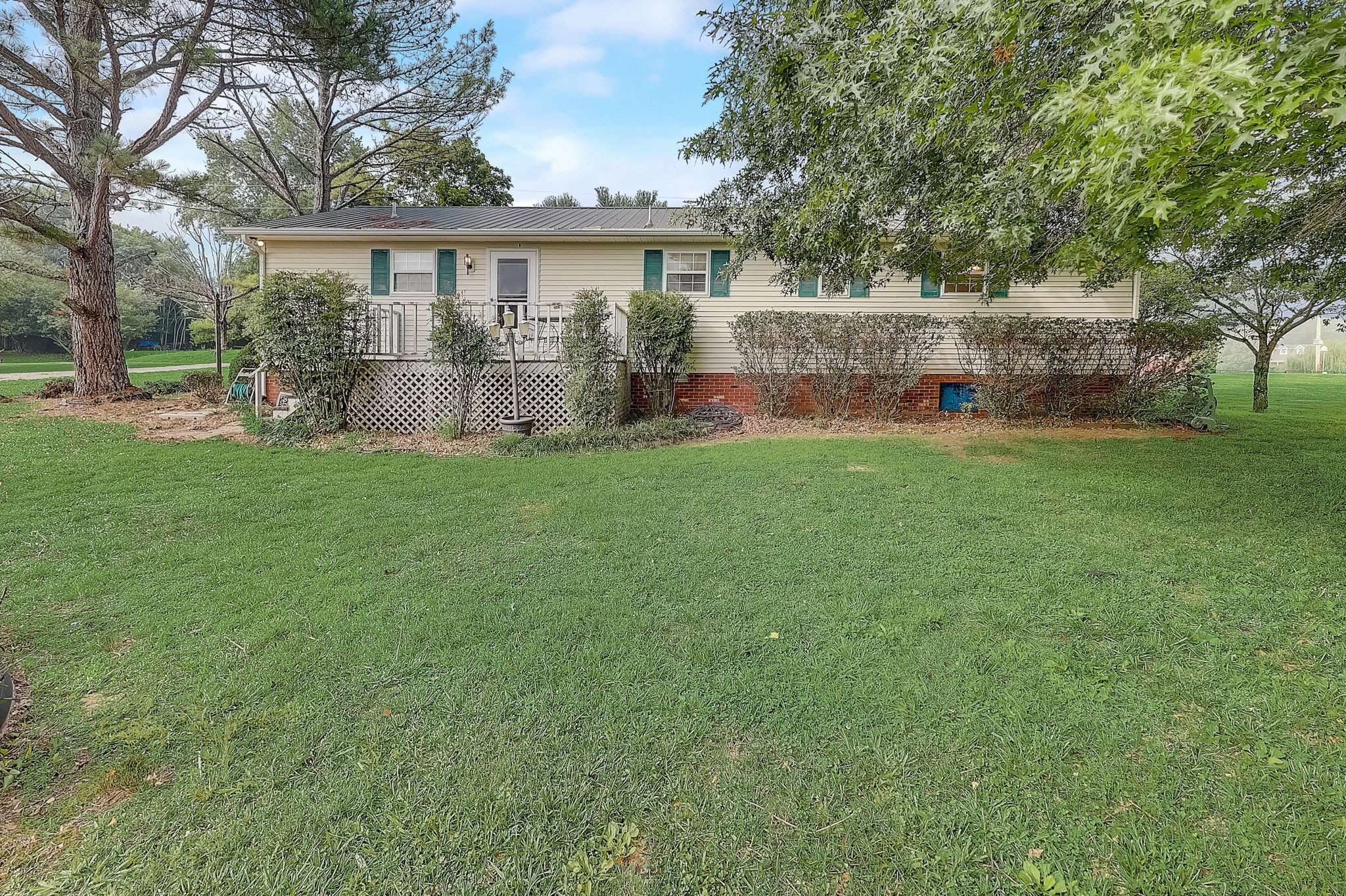 356 Howard Redmon Road Sparta, TN 38583 - Photo 47 of 68 a view of house with backyard and a garden