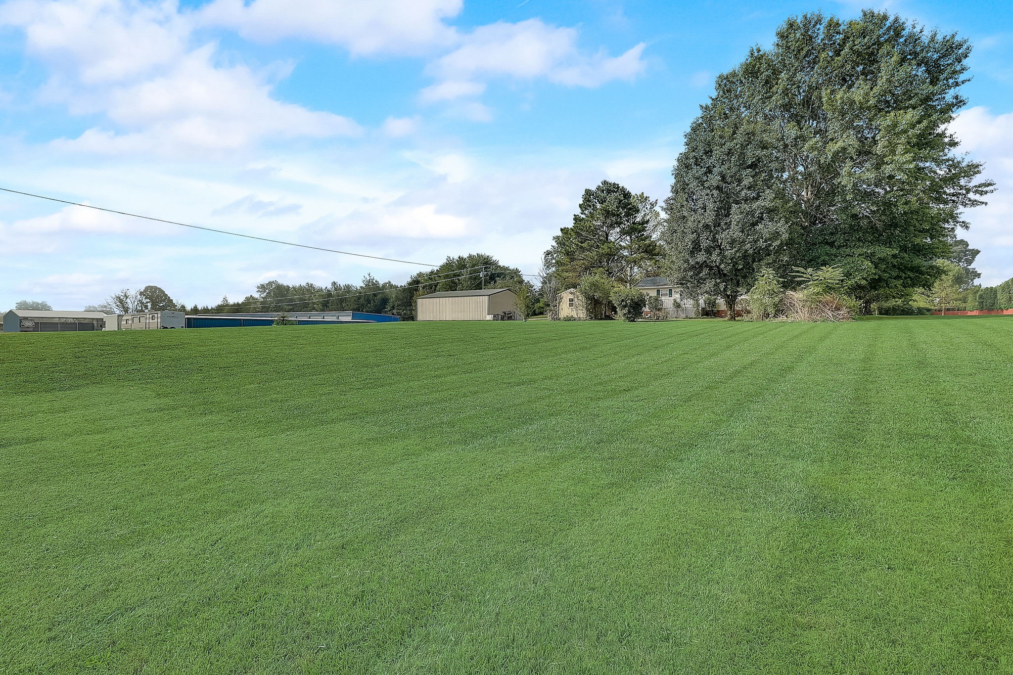 356 Howard Redmon Road Sparta, TN 38583 - Photo 53 of 68 a view of a field with an trees in the background