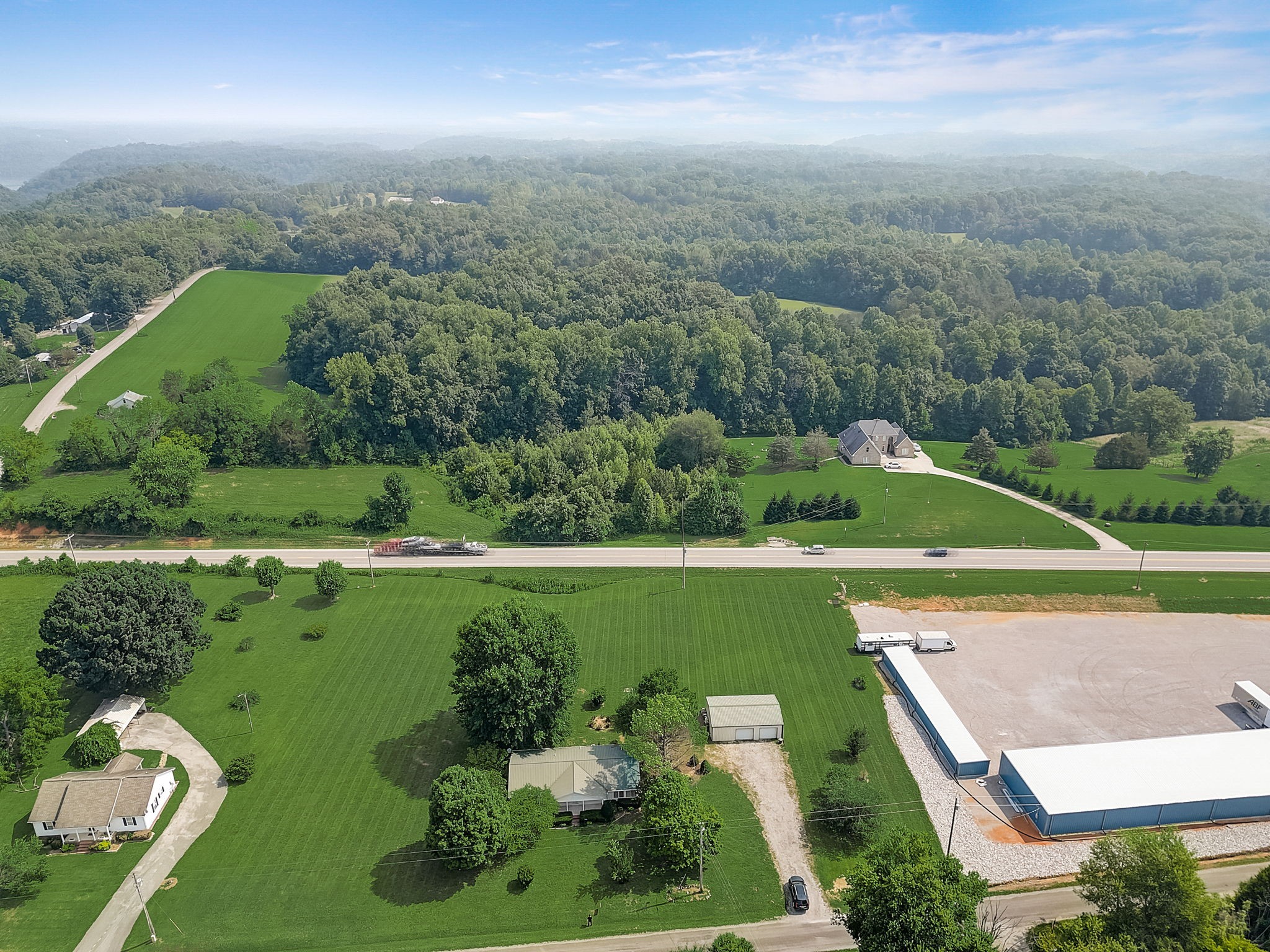 356 Howard Redmon Road Sparta, TN 38583 - Photo 65 of 68 an aerial view of a golf course with swimming pool outdoor seating and yard