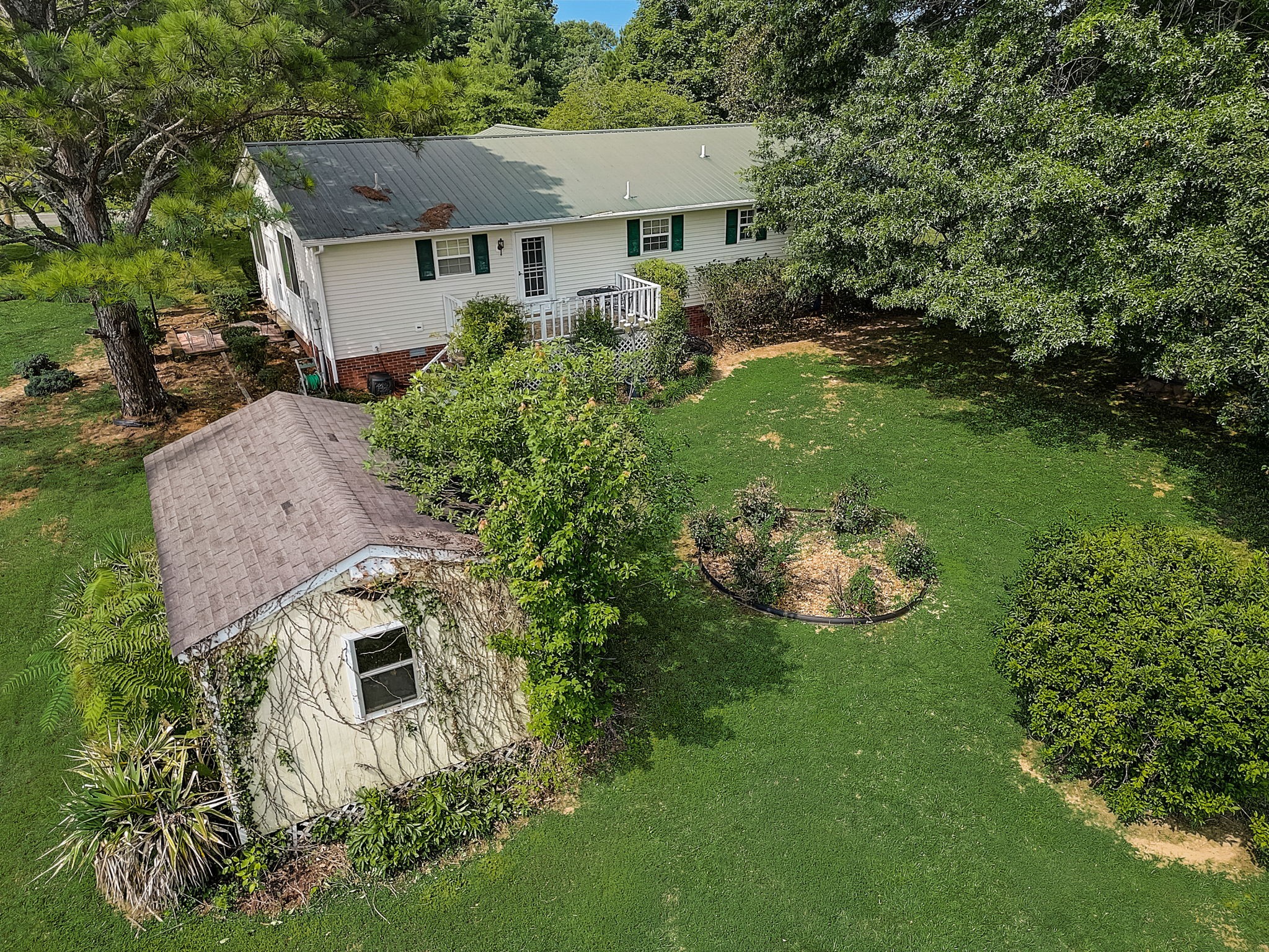 356 Howard Redmon Road Sparta, TN 38583 - Photo 67 of 68 an aerial view of a house with garden space and trees all around