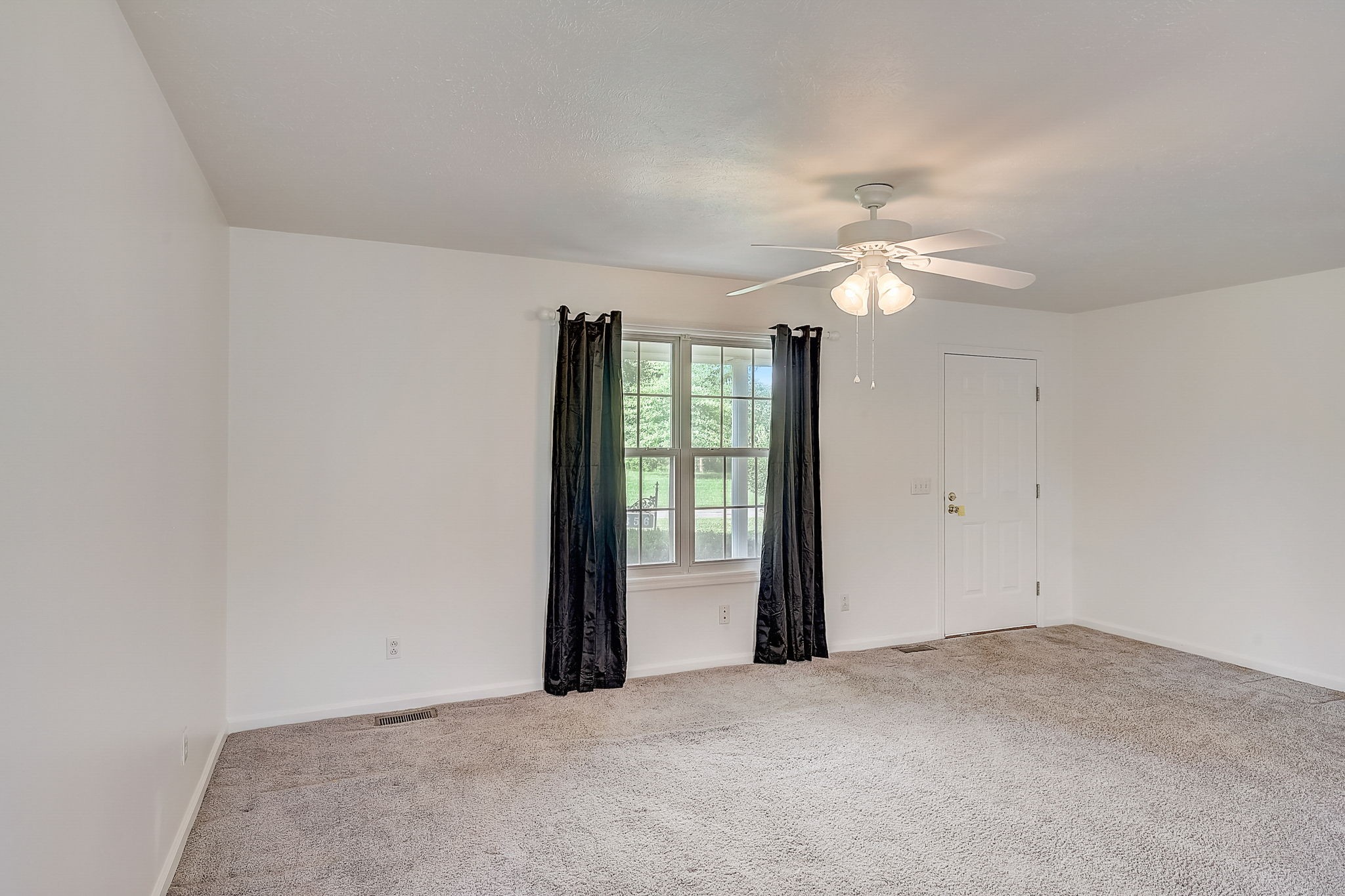 356 Howard Redmon Road Sparta, TN 38583 - Photo 9 of 68 wooden floor in an empty room with a window