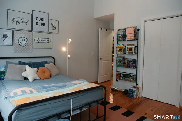 a bedroom with a bed and furniture