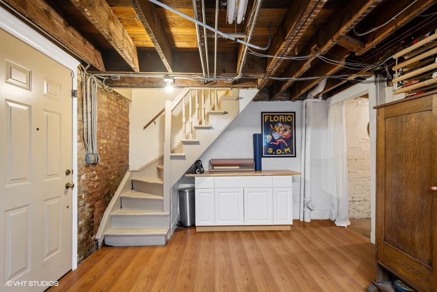 4050 North Kenmore Avenue Chicago, IL 60613 - Photo 29 of 32 a view of entryway with stairs and wooden floor
