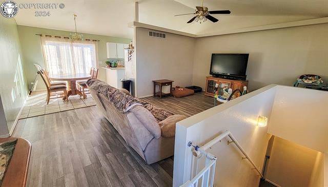 950 Quail Road Coal Creek, CO 81221 - Photo 10 of 36 Living room featuring wood-type flooring, vaulted ceiling, and ceiling fan