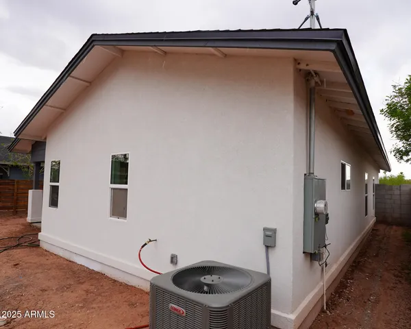 a view of house with backyard