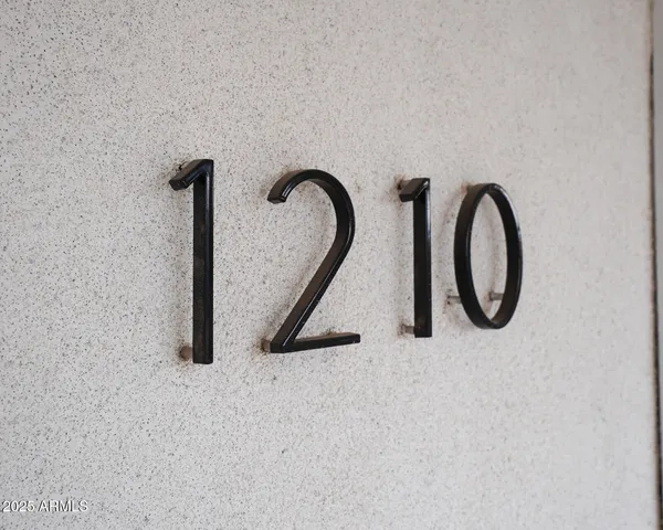 a close up of a faucet a sink and a mirror